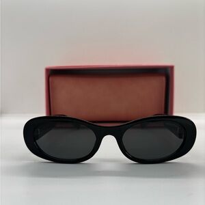 Black Oval Sunglasses with Dark Lenses